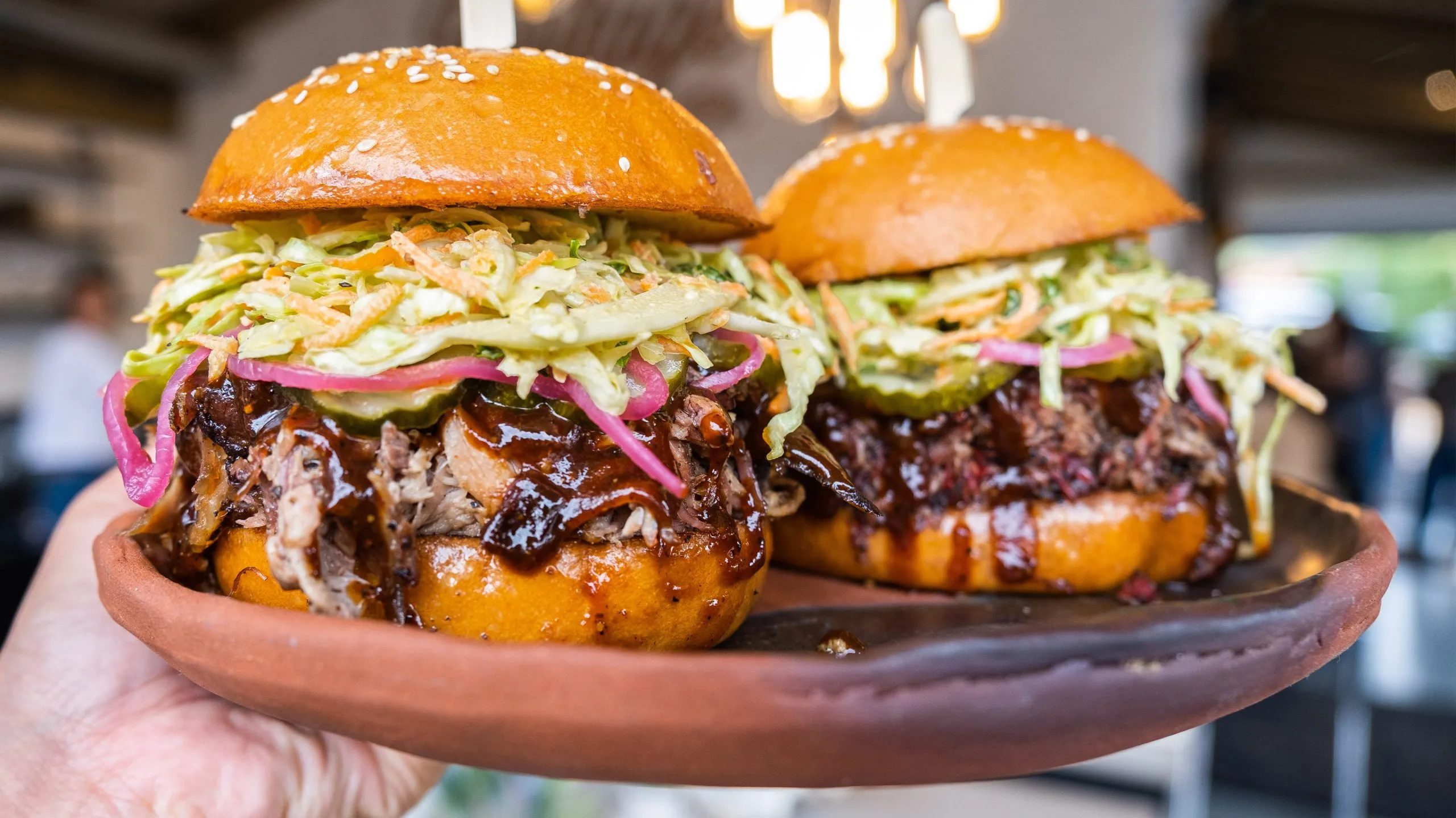 Barbecue sandwiches with slaw and pickles at Heritage Barbecue